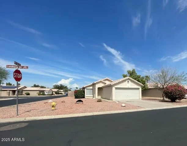a kitchen with a stove a sink and a window