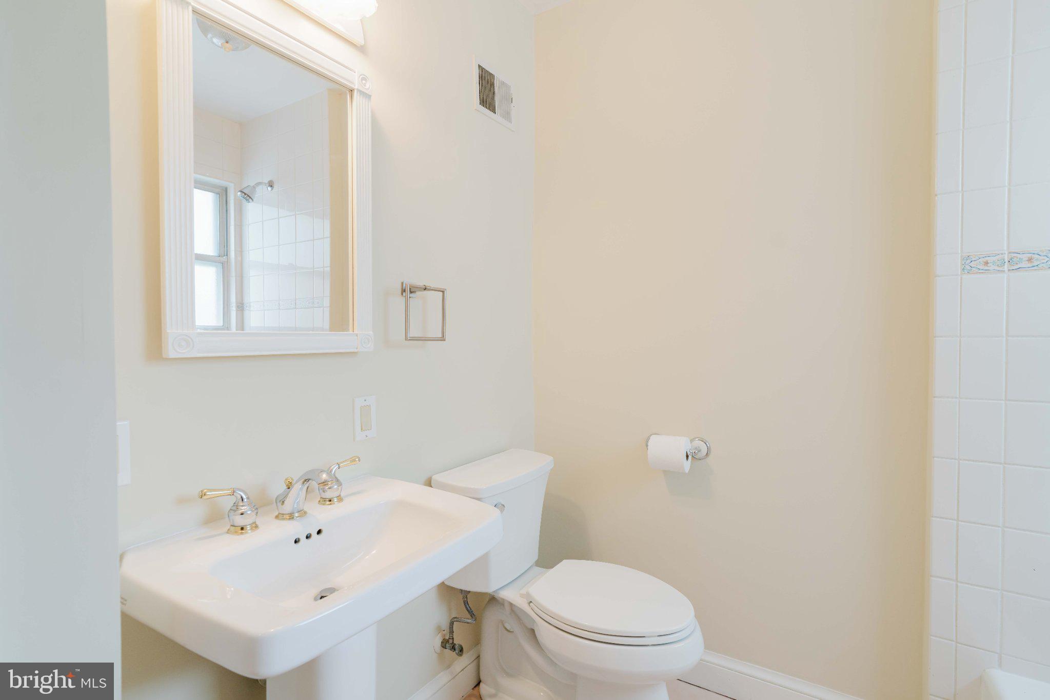 10200 Duvawn Place Silver Spring, MD 20902 - Photo 15 of 42 Bright and airy bathroom retreat.