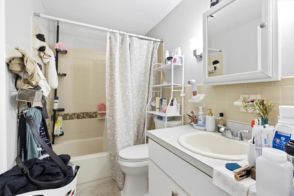 2511 West Abdella Street Tampa, FL 33607 - Photo 12 of 17 a bathroom with a sink a toilet and shower