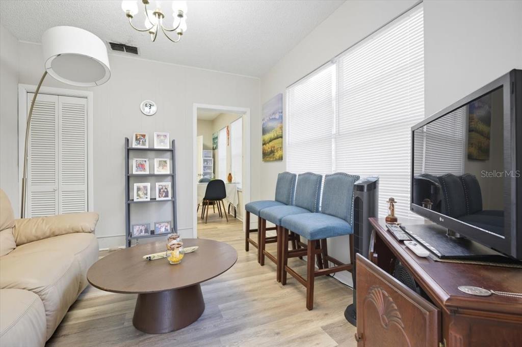 2511 West Abdella Street Tampa, FL 33607 - Photo 5 of 17 a living room with furniture and a flat screen tv