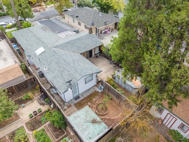 a aerial view of a house with a yard