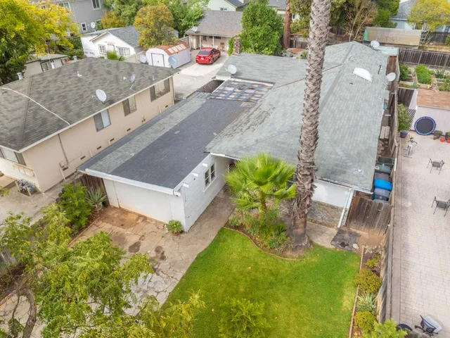 an aerial view of residential houses with outdoor space