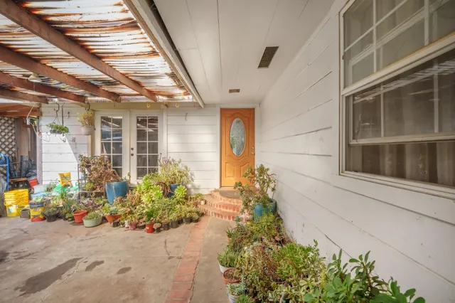 a kitchen with stainless steel appliances granite countertop a refrigerator a microwave a sink and a stove