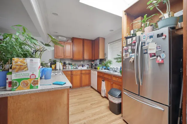 a bathroom with a sink toilet and a mirror