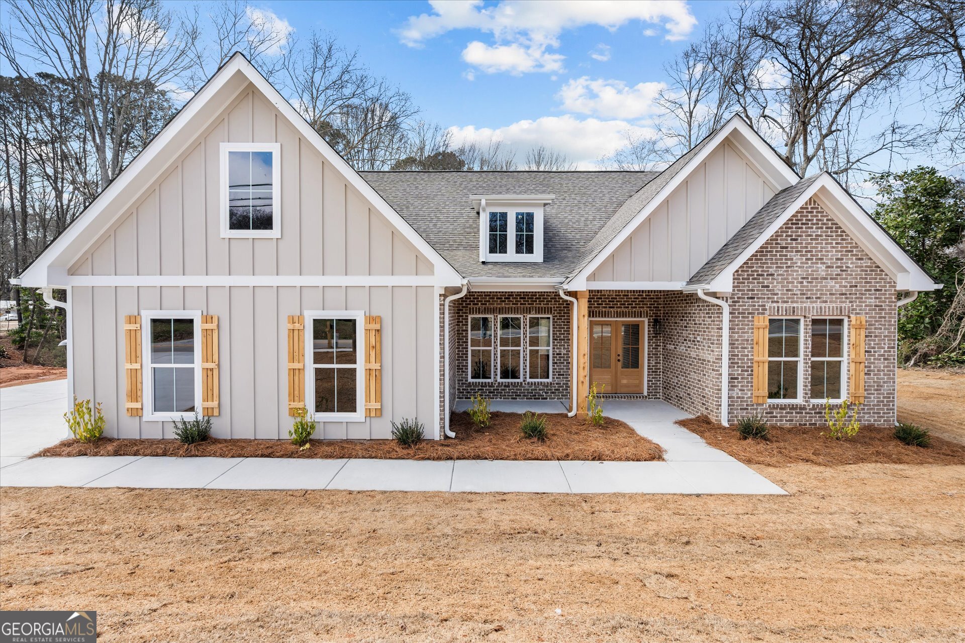a front view of a house with a yard