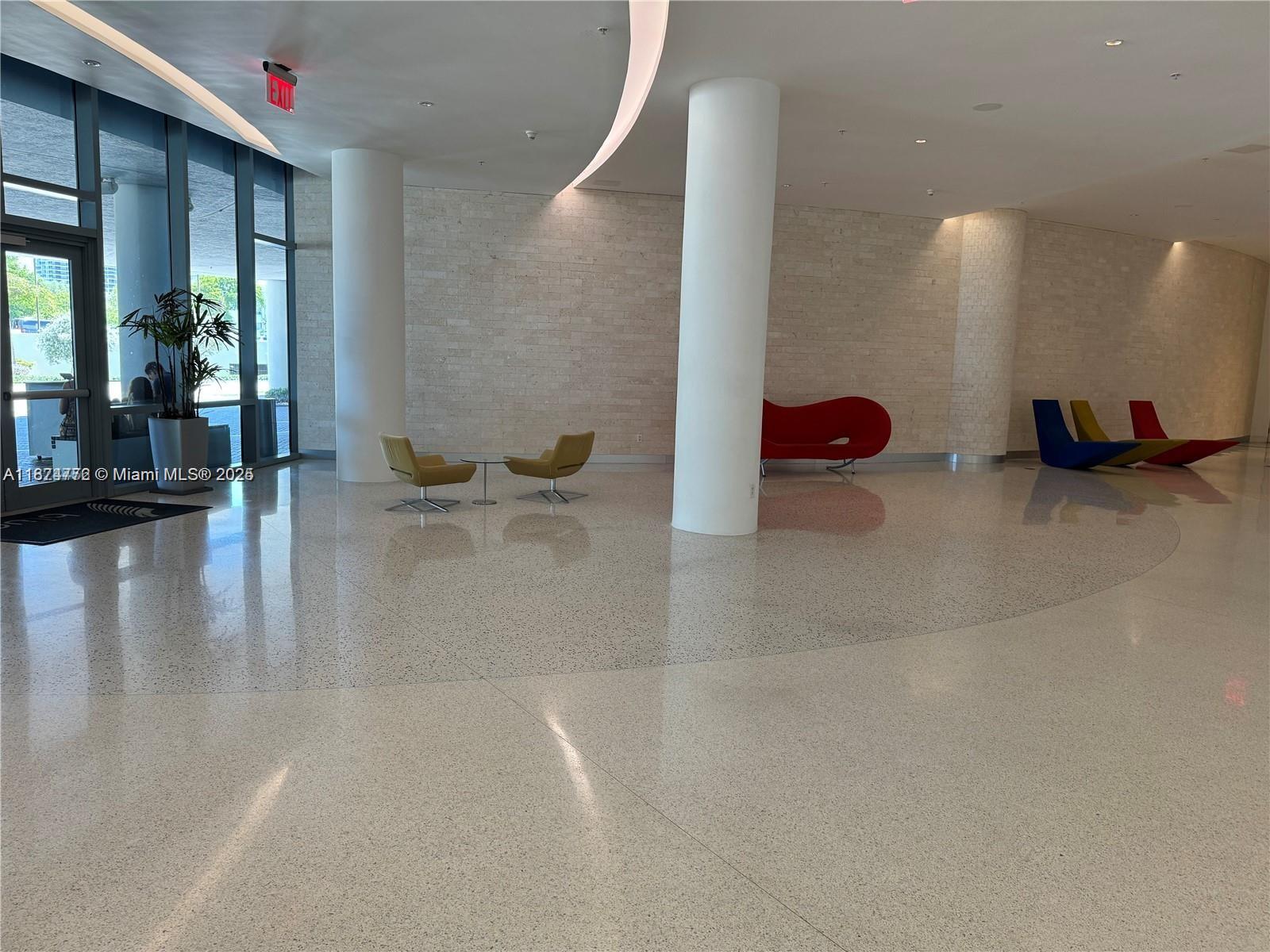601 Northeast 36th Street, Unit 806 Miami, FL 33137 - Photo 11 of 28 a view of a hallway with seating area