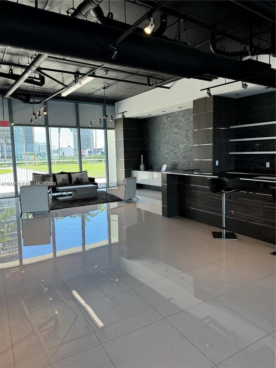 601 Northeast 36th Street, Unit 806 Miami, FL 33137 - Photo 15 of 28 a view of a patio with a table and chairs