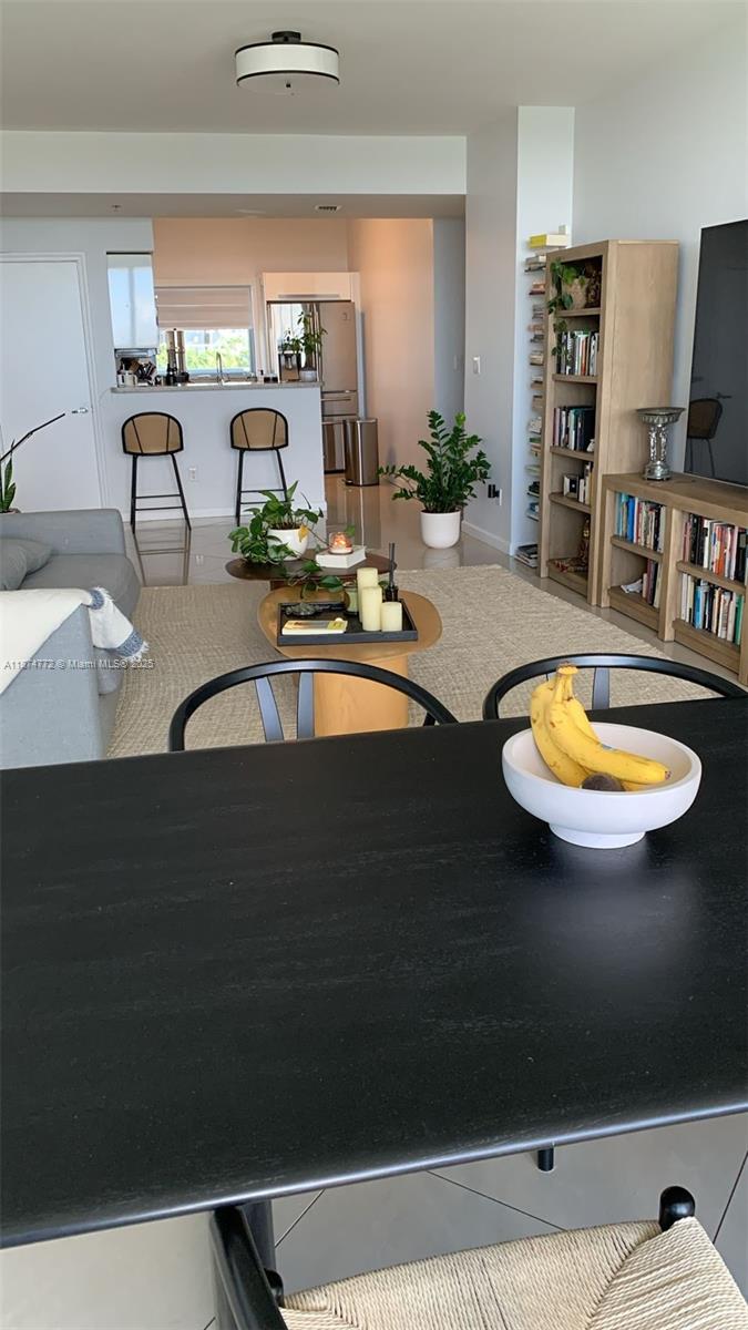 601 Northeast 36th Street, Unit 806 Miami, FL 33137 - Photo 18 of 28 a bathroom with a sink a mirror and bathtub