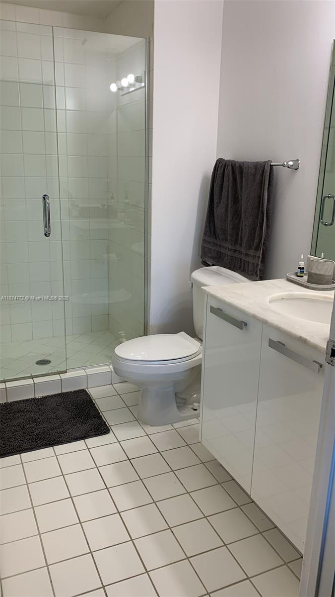 601 Northeast 36th Street, Unit 806 Miami, FL 33137 - Photo 19 of 28 a bathroom with a sink a toilet and shower
