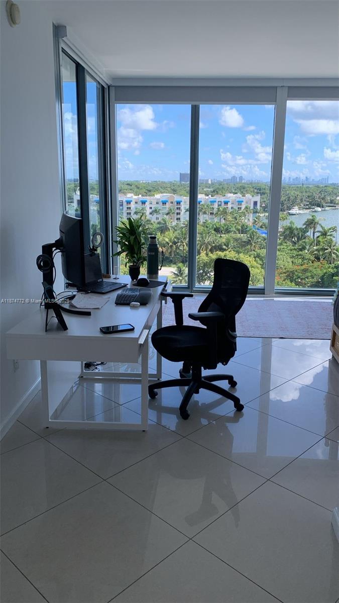 601 Northeast 36th Street, Unit 806 Miami, FL 33137 - Photo 27 of 28 a living room with furniture and floor to ceiling windows