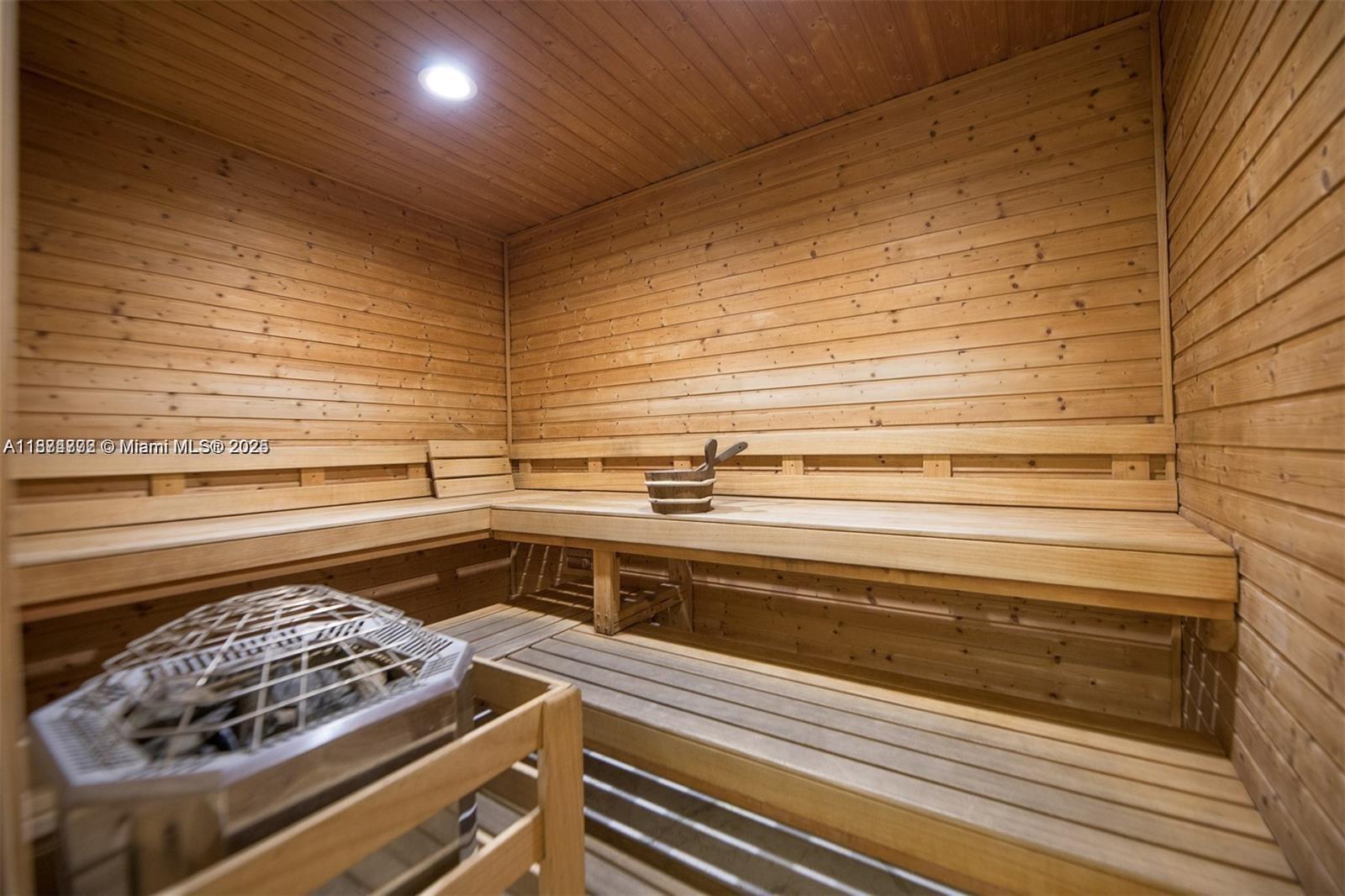 601 Northeast 36th Street, Unit 806 Miami, FL 33137 - Photo 6 of 28 a kitchen with a stove and white cabinets