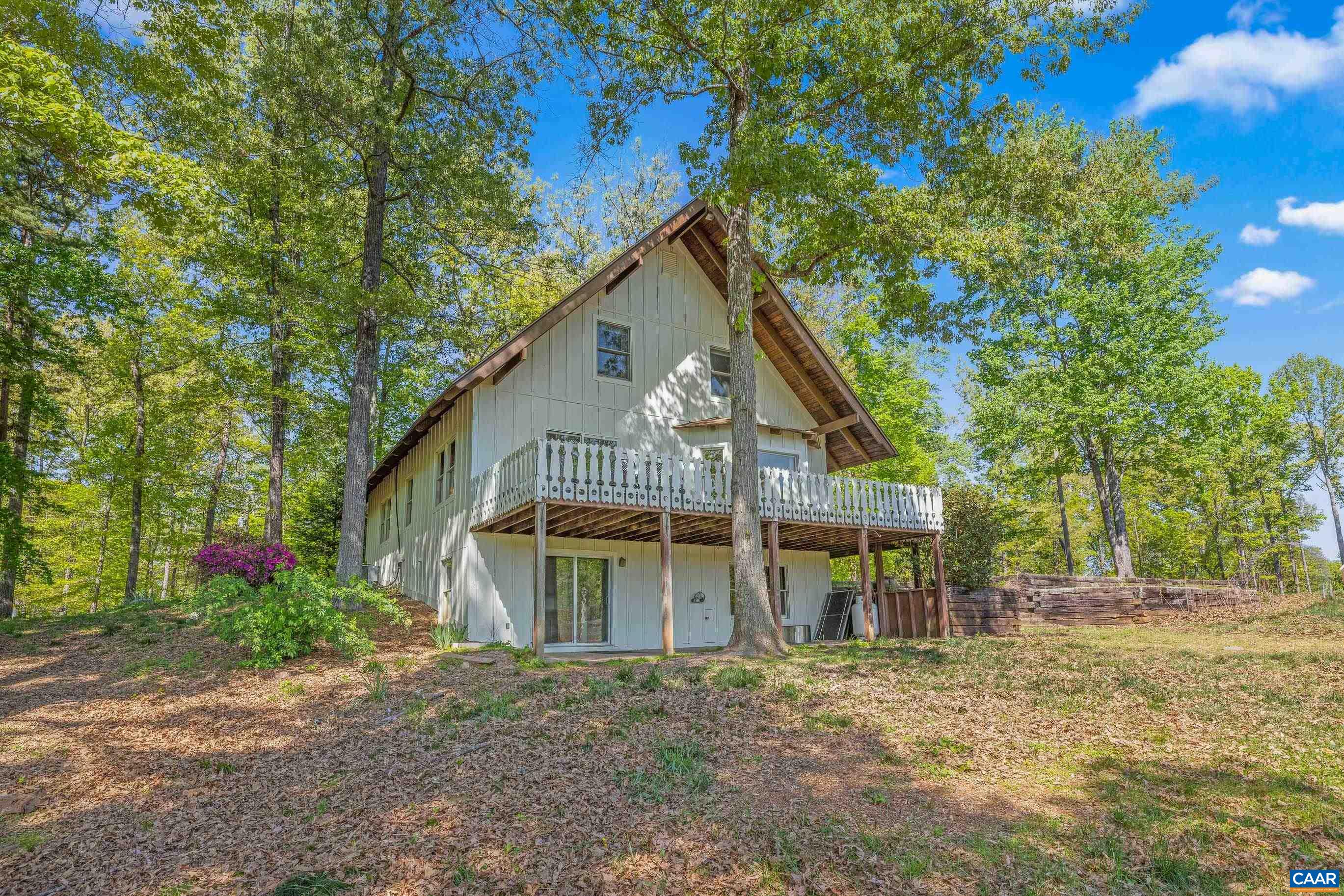2947 Merrie Meadows Lane Keswick, VA 22947 - Photo 11 of 75 a front view of a house with garden