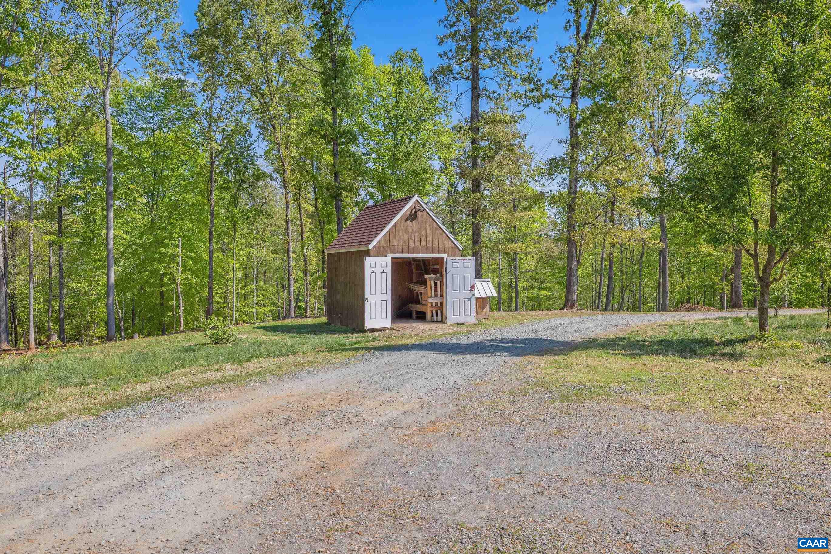 2947 Merrie Meadows Lane Keswick, VA 22947 - Photo 14 of 75 a house with a tree in the background