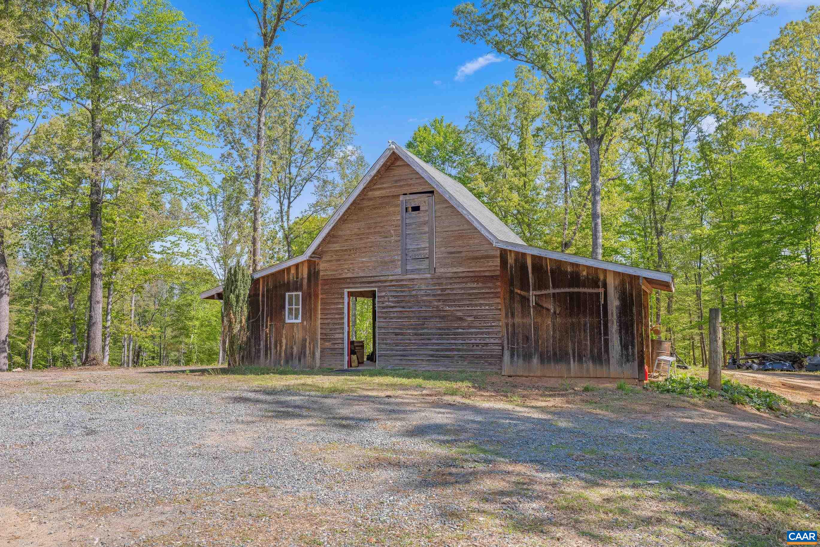 2947 Merrie Meadows Lane Keswick, VA 22947 - Photo 17 of 75 a front view of house with a garden