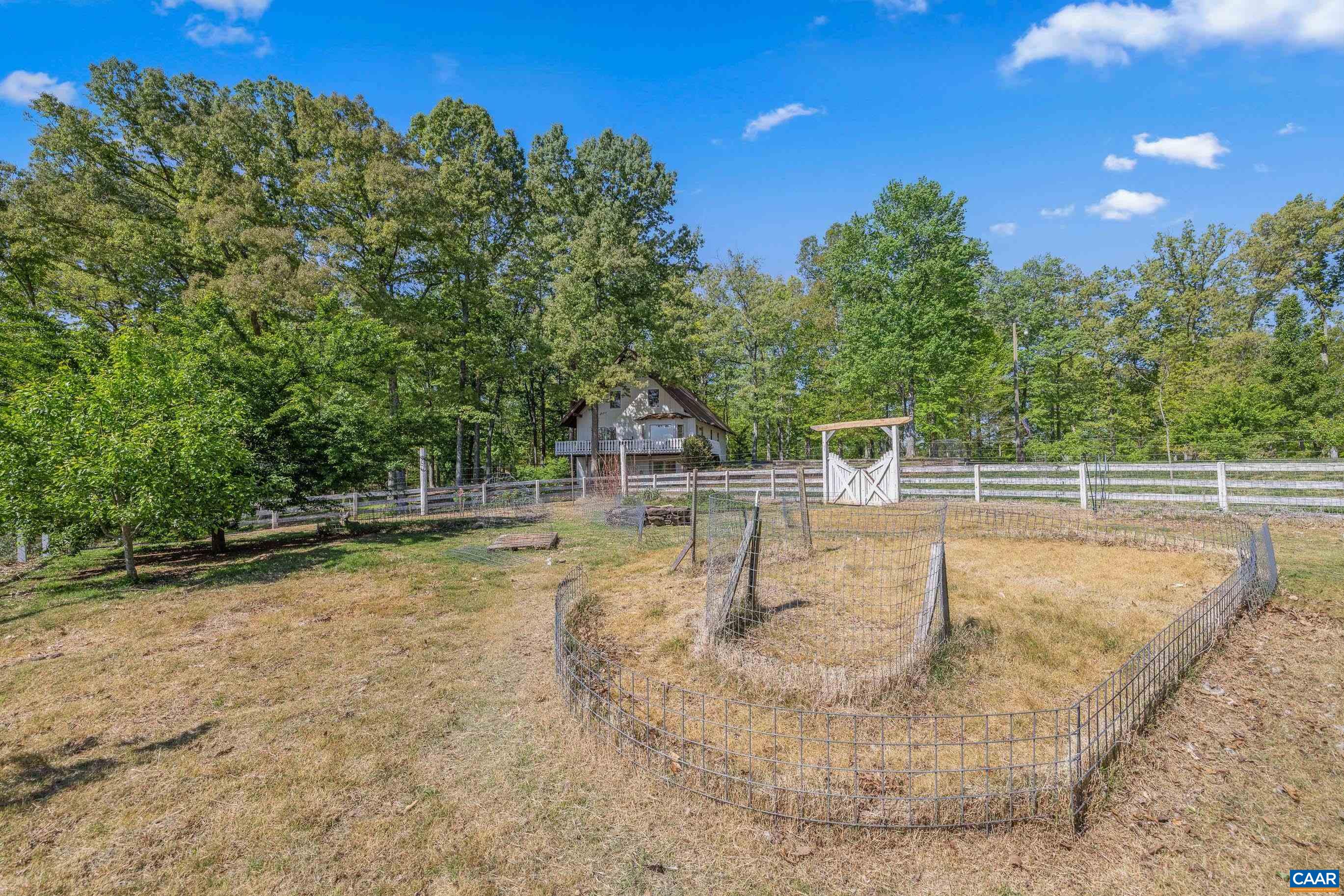 2947 Merrie Meadows Lane Keswick, VA 22947 - Photo 22 of 75 a view of a swimming pool with a yard