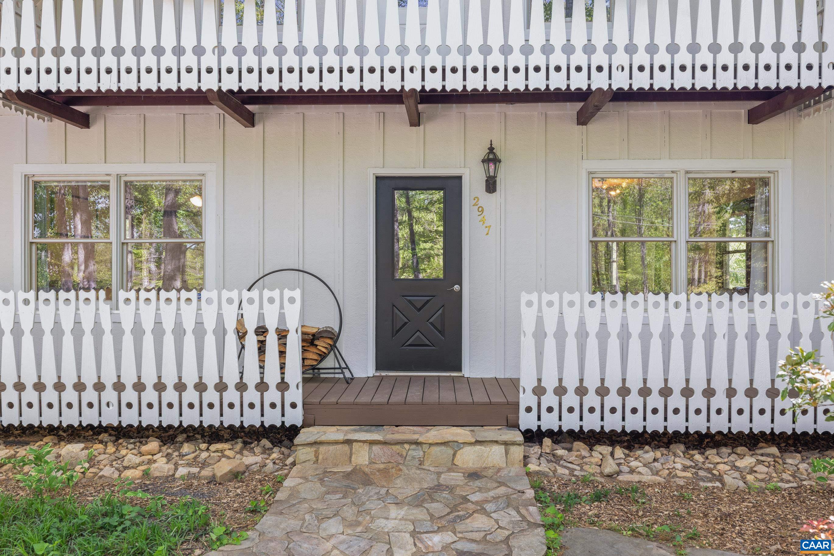 2947 Merrie Meadows Lane Keswick, VA 22947 - Photo 27 of 75 a view of a porch with a bench