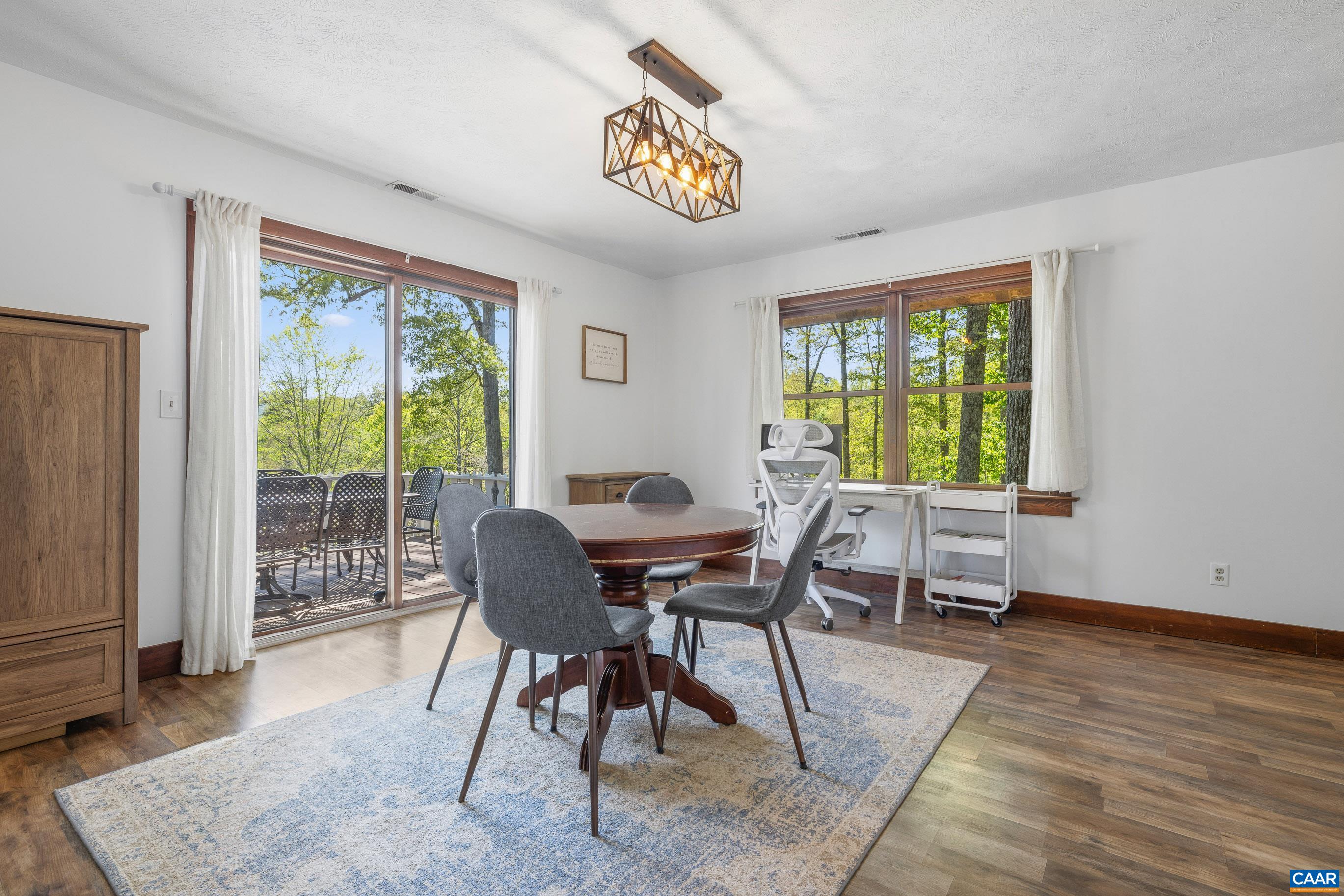 2947 Merrie Meadows Lane Keswick, VA 22947 - Photo 36 of 75 a view of a dining room with furniture window and outside view