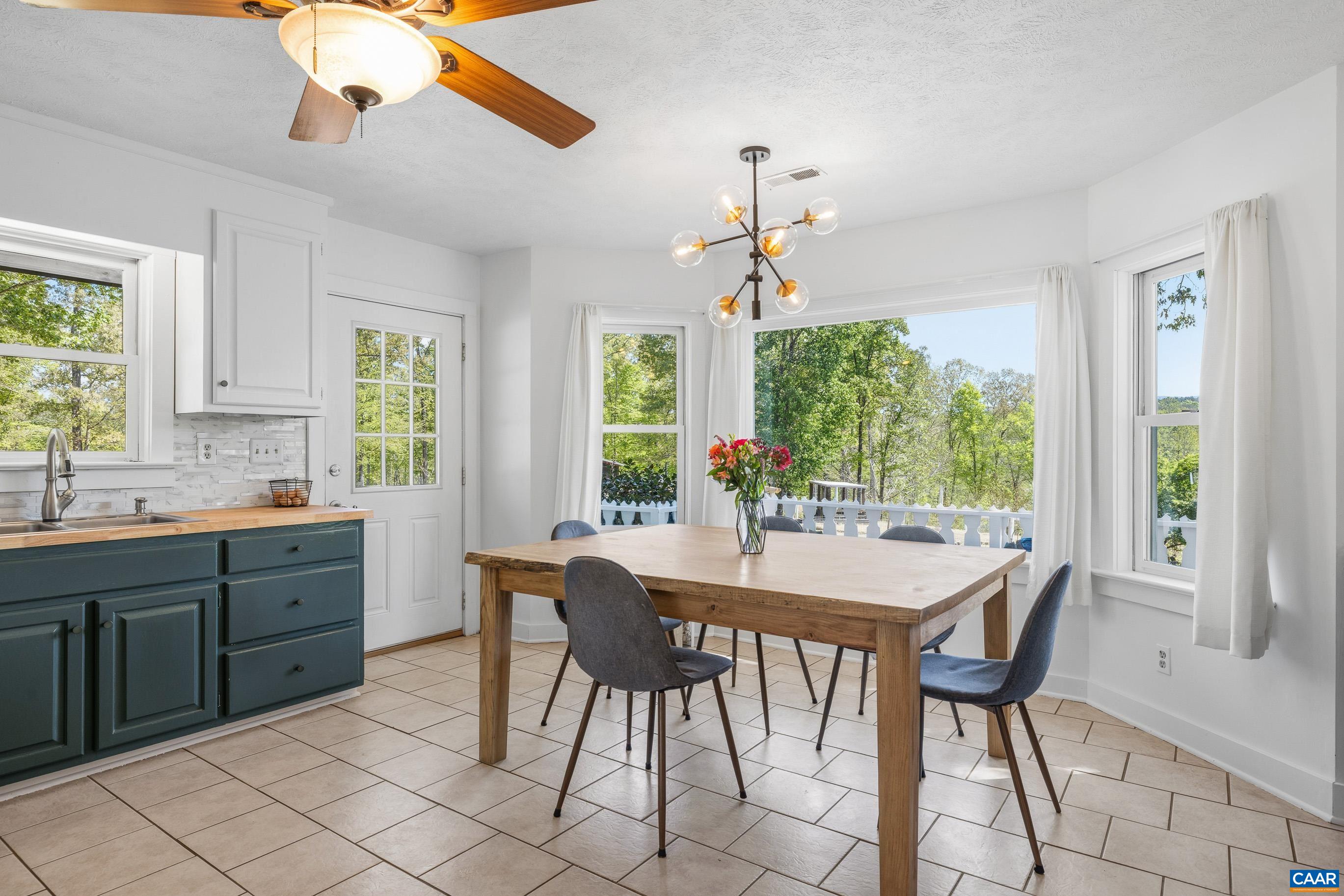 2947 Merrie Meadows Lane Keswick, VA 22947 - Photo 37 of 75 a view of a dining room with furniture window and outside view