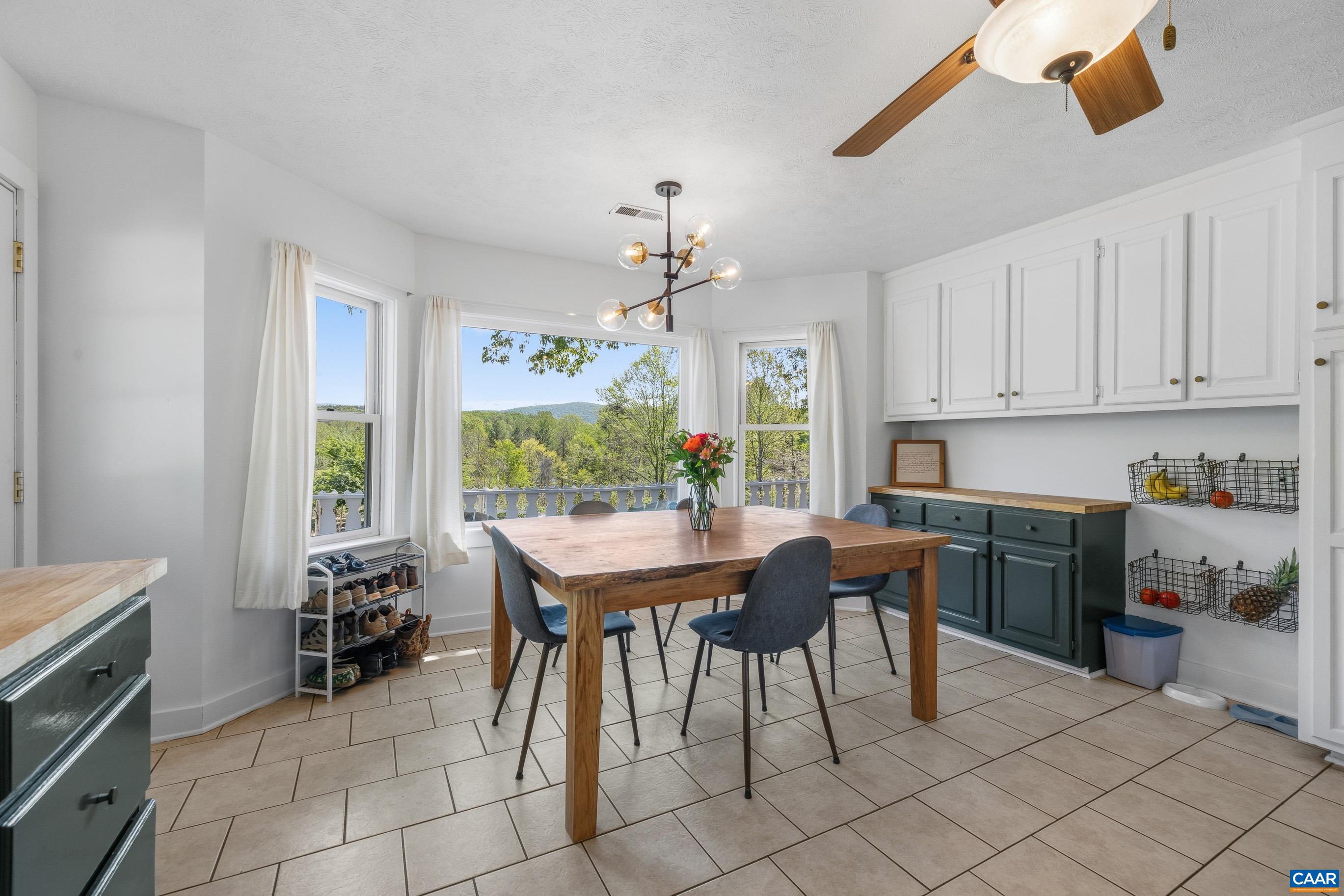 2947 Merrie Meadows Lane Keswick, VA 22947 - Photo 39 of 75 a view of a dining room with furniture window and outside view