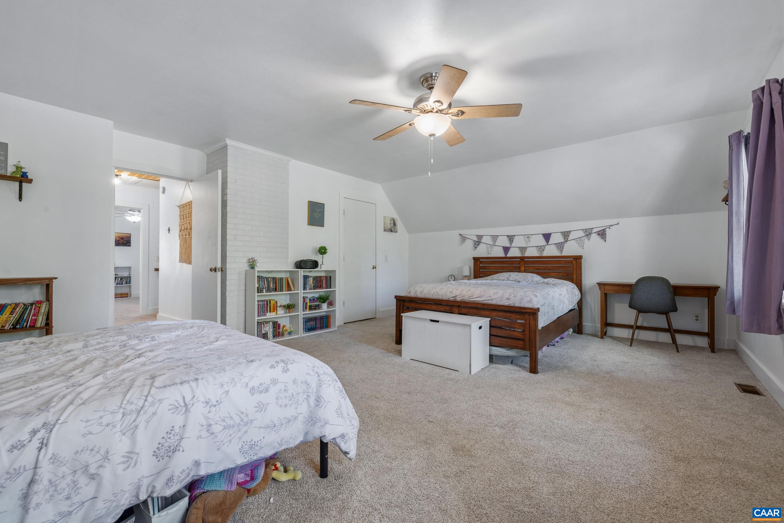 2947 Merrie Meadows Lane Keswick, VA 22947 - Photo 47 of 75 a bedroom with furniture and a chandelier