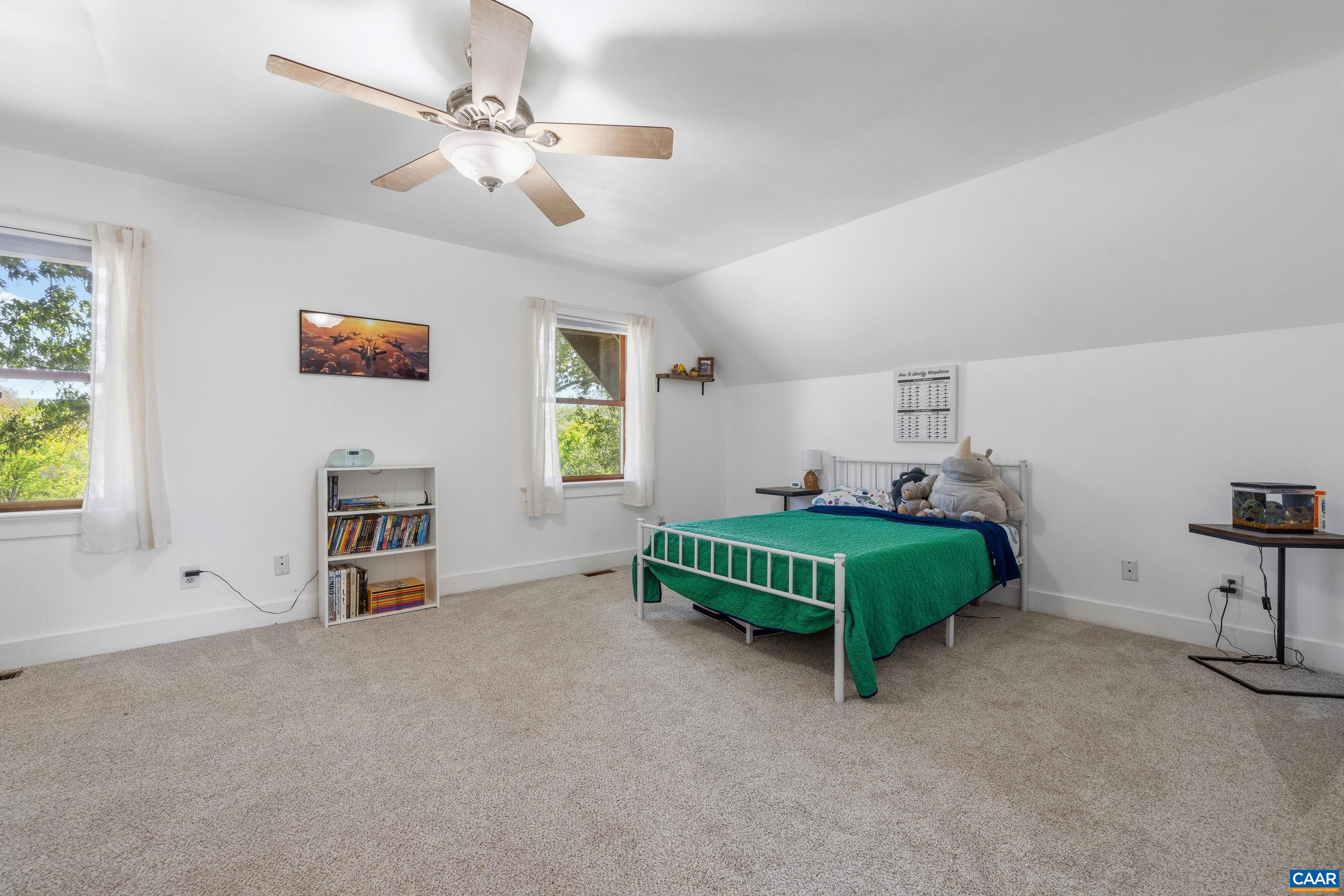 2947 Merrie Meadows Lane Keswick, VA 22947 - Photo 50 of 75 a bedroom with furniture and a window