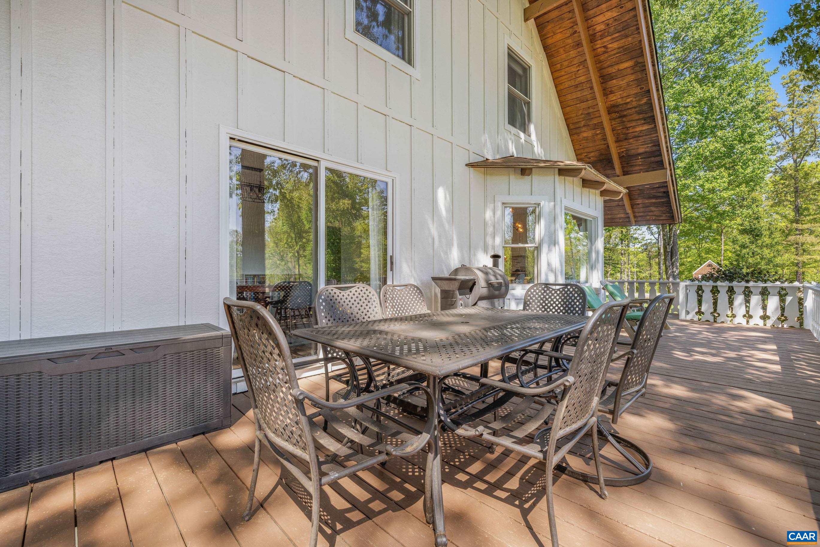 2947 Merrie Meadows Lane Keswick, VA 22947 - Photo 67 of 75 a view of an outside dining space with furniture window