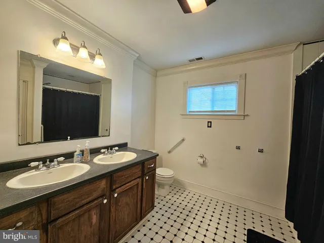 a view of a storage and utility room with washer and dryer