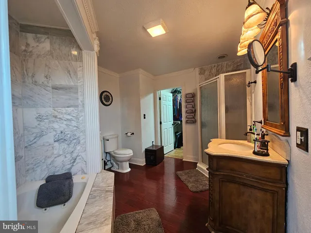 a view of a bathroom with a tub and shower