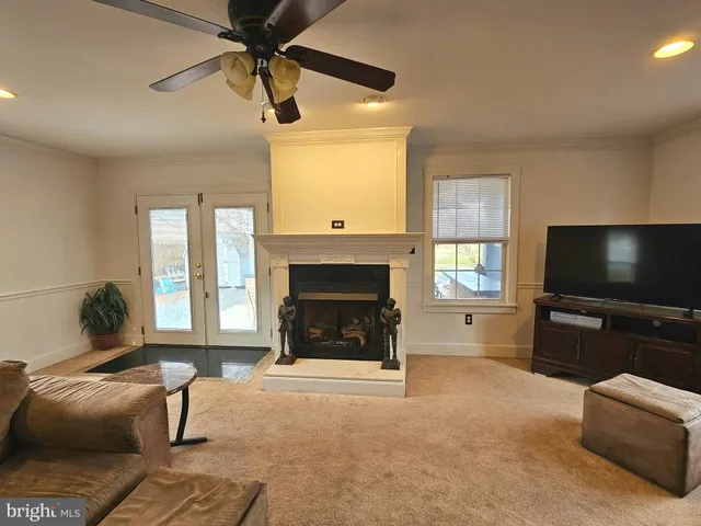 a kitchen with stainless steel appliances granite countertop a stove a sink dishwasher and a microwave oven with cabinets