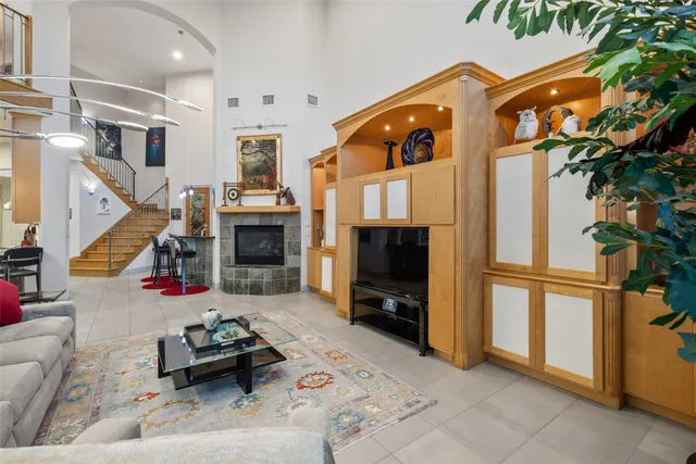 a large kitchen with stainless steel appliances lots of counter space and a sink