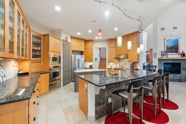 a room with lots of chairs and mirrors