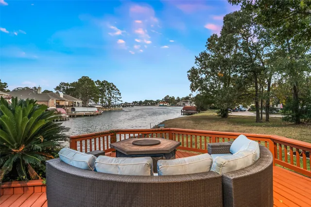 a view of swimming pool with seating area and barbeque oven