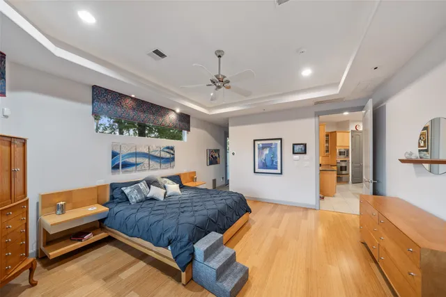 a large spacious bathroom with a tub a double vanity sink a mirror and shower