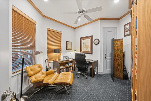 a bathroom with a granite countertop toilet sink and mirror