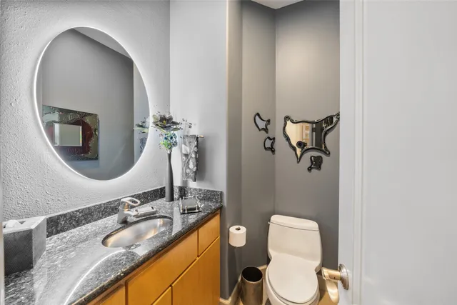 a utility room with cabinets washer and dryer