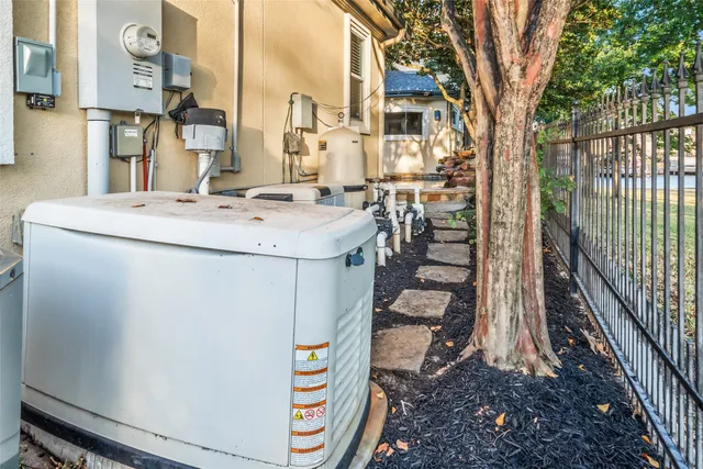 a view of residential house with wooden fence
