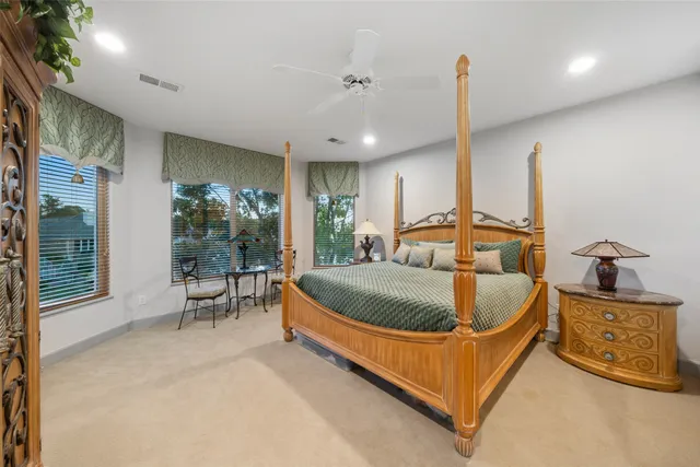 a living room with furniture kitchen view and a potted plant