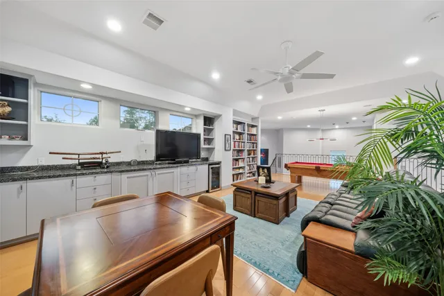 a room with furniture and pool table