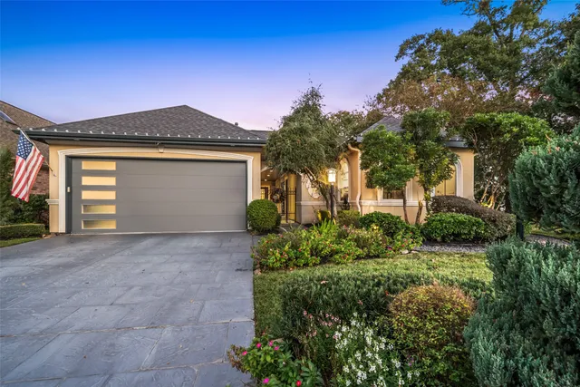 a view of a backyard with table and chairs and wooden fence
