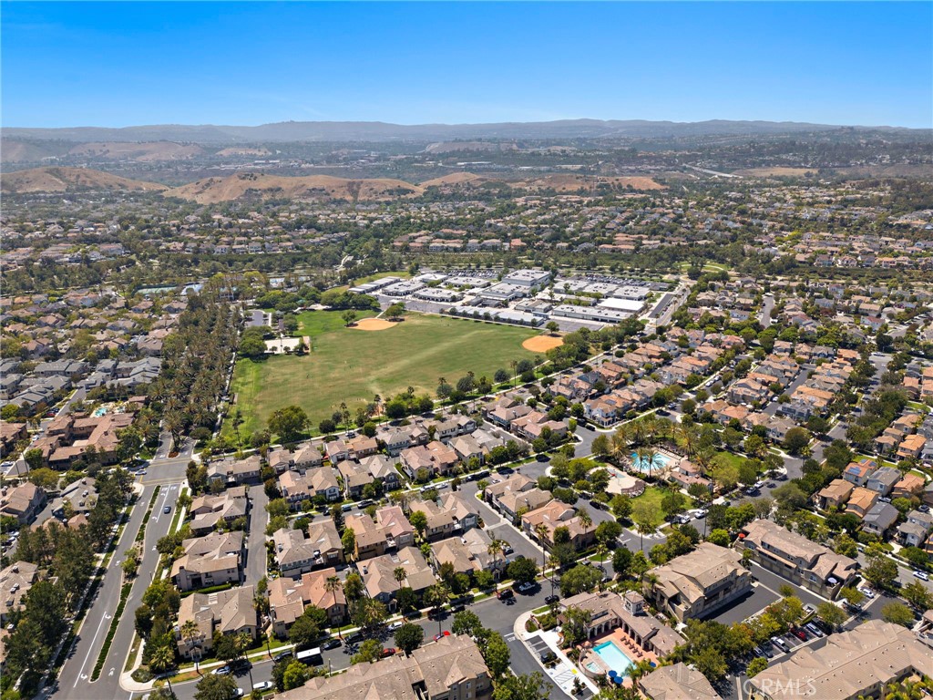 71 Sklar Street Ladera Ranch, CA 92694 - Photo 48 of 55 an aerial view of residential building and lake