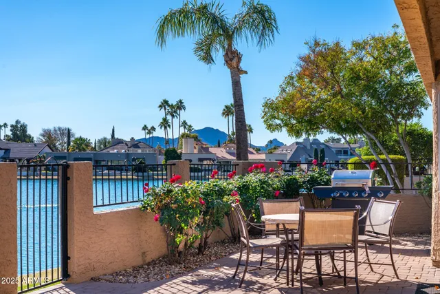 a view of a chairs and table in the patio