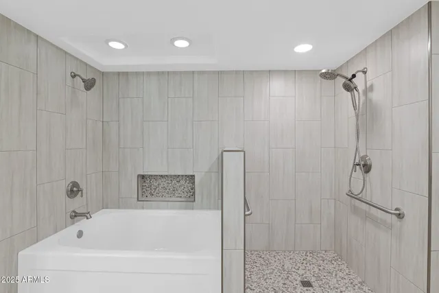 a bedroom with a bed and a night stand