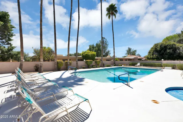 an aerial view of a house with a garden and swimming pool
