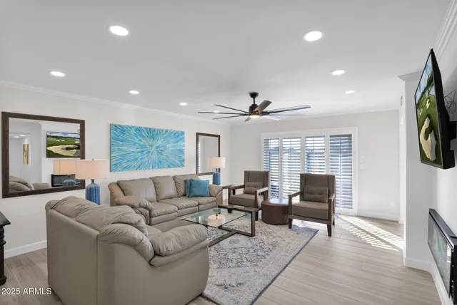 a living room with furniture and a flat screen tv