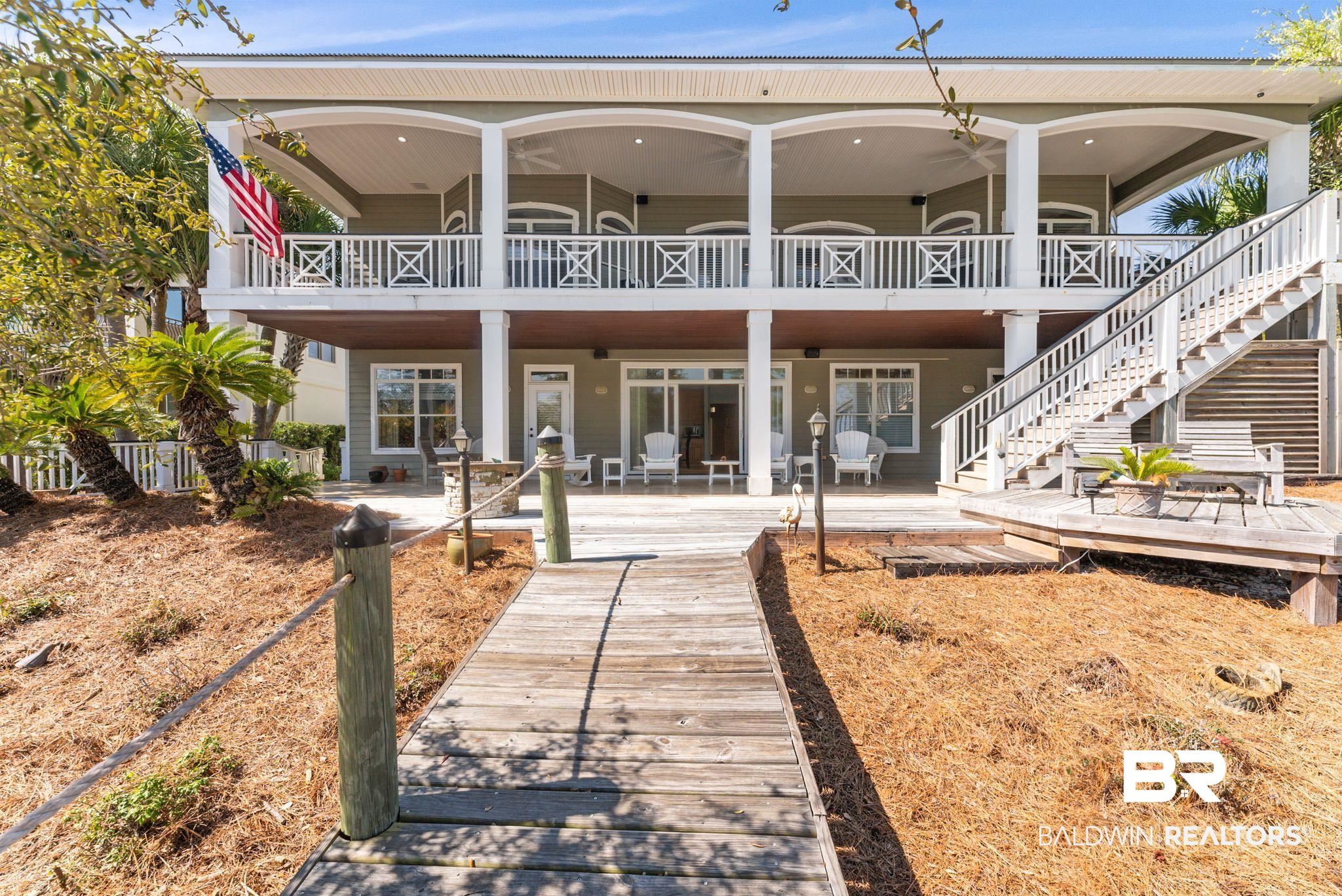 30818 River Road Orange Beach, AL 36561 - Photo 4 of 81 Back of property with a deck, a patio area, and ceiling fan