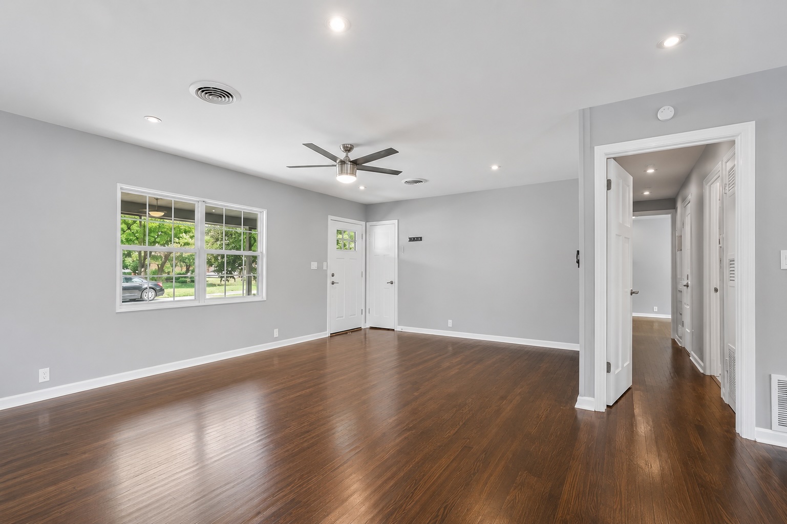 2105 Fortview Road Austin, TX 78704 - Photo 7 of 37 Refined wood flooring flows through this adaptable living space, ready for your personalized touch.