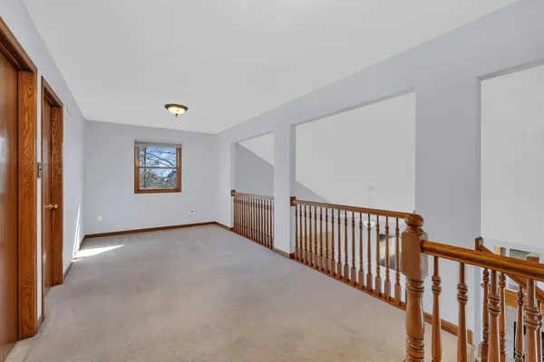 a view of an empty room with storage