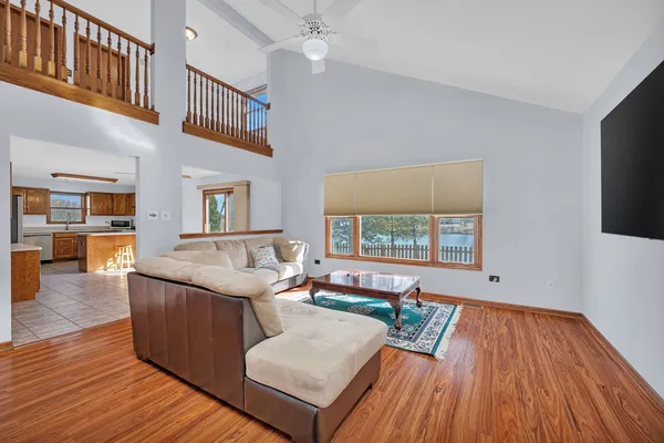 a kitchen with stainless steel appliances granite countertop a sink a stove and cabinets
