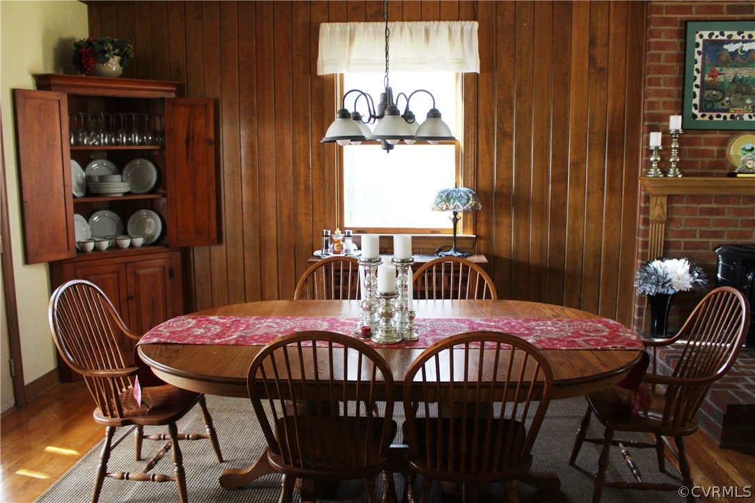6501 Moseley Road Moseley, VA 23120 - Photo 11 of 27 a view of a dining room with furniture and chandelier
