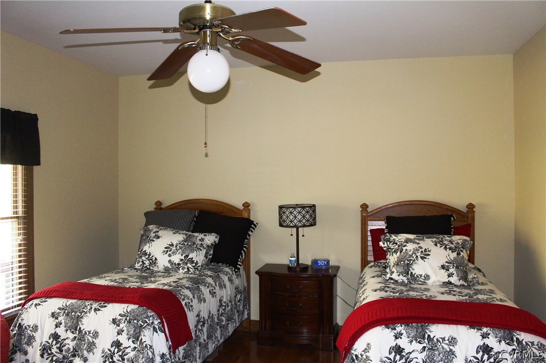 6501 Moseley Road Moseley, VA 23120 - Photo 16 of 27 a bedroom with a bed and lamp